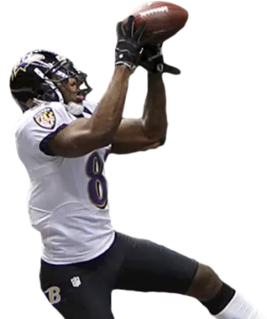 a football player catching a ball in the air