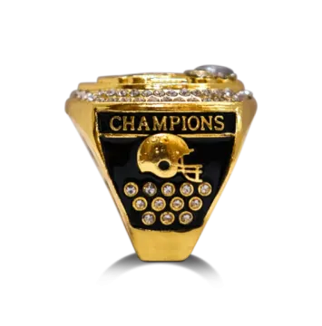 a gold and black ring with diamonds on it