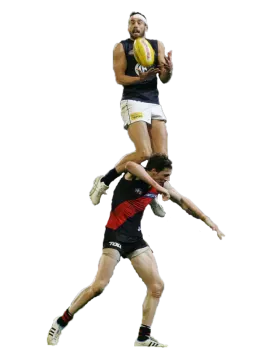 a man is jumping in the air with a ball