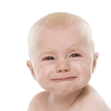 a baby crying with tears on his face