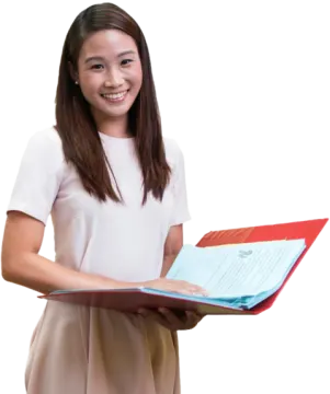 a young girl holding a book in her hands
