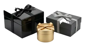 a black and gold gift box with a bow