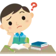 a boy sitting at his desk with a book
