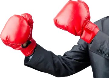 a man in a suit and red boxing gloves