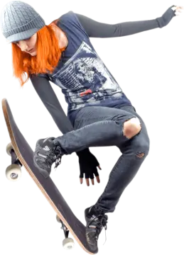 a girl is doing a trick on a skateboard