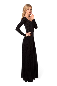 a woman wearing a black long sleeved dress