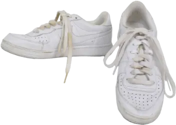 a pair of white sneakers on a white background