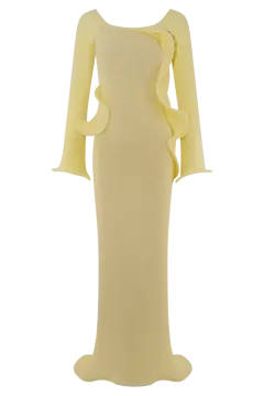 a woman wearing a yellow dress with long sleeves