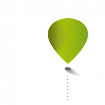a green balloon flying through the air