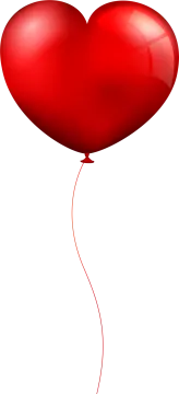 a red heart shaped balloon flying in the air