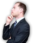 a man in a suit and tie with his hand on his chin
