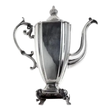an antique silver plated teapot on stand