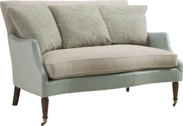 a couch with two pillows on top of it