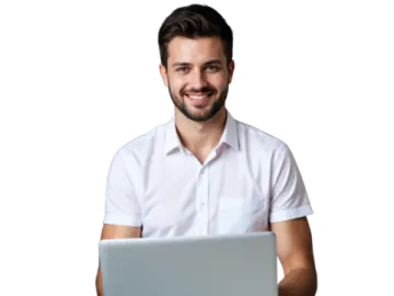 a man sitting in front of a laptop