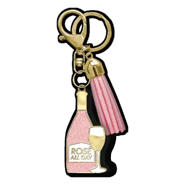a bottle of champagne with a pink ribbon on it