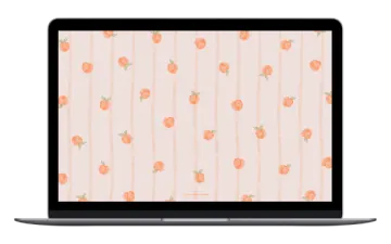 a laptop with a peach pattern on the screen