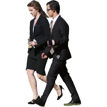 a man and woman in business attire walking together