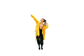 a woman in a yellow raincoat and black pants