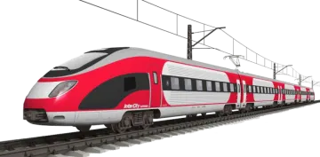 a red and white train on tracks