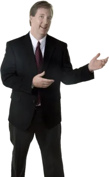a man in a suit and tie with his hands out