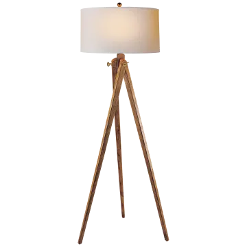a wooden floor lamp with a white shade