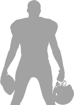a silhouette of a football player holding a ball