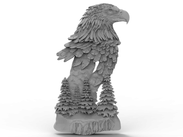 a statue of an eagle sitting on top of a tree