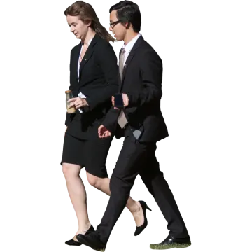a man and woman in business attire walking