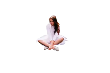 a woman sitting on the floor with her legs crossed