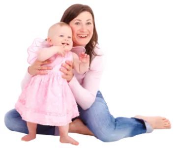 a woman holding a baby in her arms
