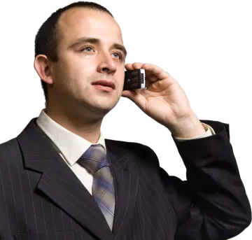 a man in a suit talking on a cell