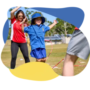 a boy and girl playing with a kite