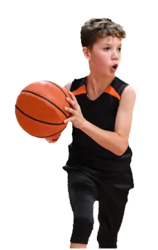a young boy holding a basketball ball