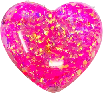 a pink heart shaped balloon filled with glitter