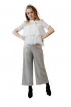 a woman in a white shirt and grey pants
