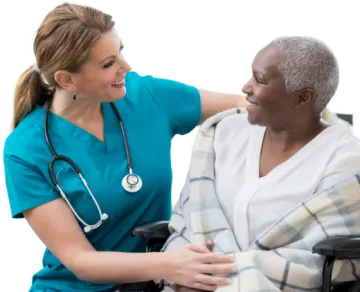 a woman in a wheelchair with a doctor