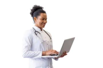 a woman in a white lab coat holding a laptop