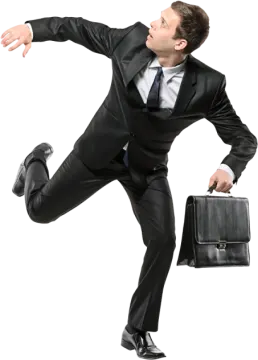 a man in a suit is jumping with his briefcase