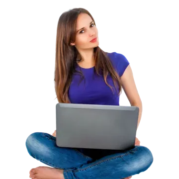 a woman sitting on the floor with her laptop