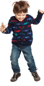 a young boy in a blue sweater and jeans