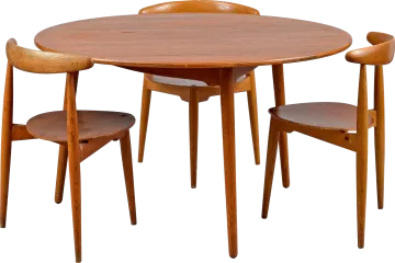 a round wooden table with four chairs