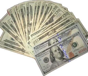 a pile of hundred dollar bills