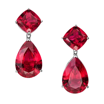 a pair of earrings with red crystals
