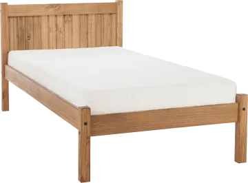 a wooden bed with white sheets on it