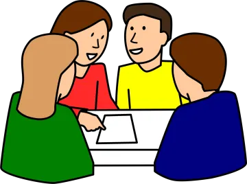 a group of people sitting around a table