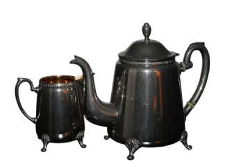 a black coffee pot and a silver teapot