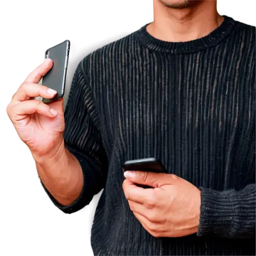 a man holding a cell and looking at his phone