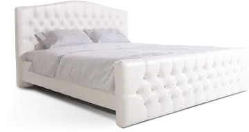 a white bed with an upholing headboard