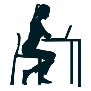 a silhouette of a woman sitting at a desk with her laptop