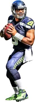 a man in a football uniform holding a ball
